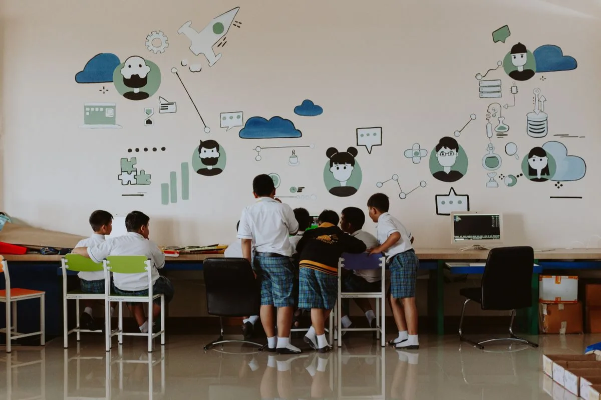 Students working at computers in a classroom lab